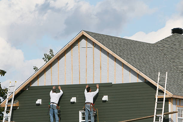 Professional Siding Replacement technician working in Merion Station, PA